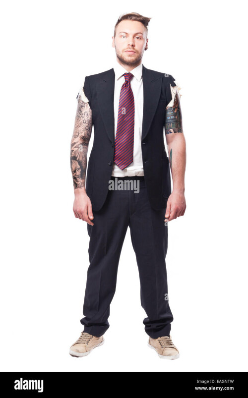 businessman in a suit with no sleeves and tattoo on his arms EAGNTW