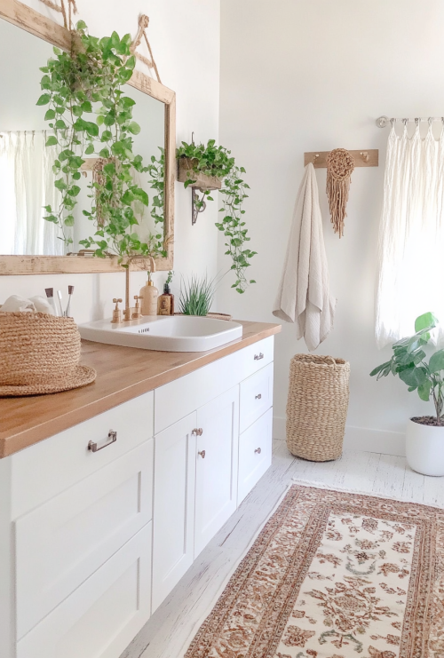 carlooo5441_A_boho_bathroom_with_white_cabinets_wood_countert_da306462-946e-452b-b770-f44be9cccf2e_0.png