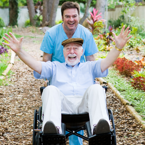 Elderly-gentleman-in-wheelchair-with-fun-768x768.png