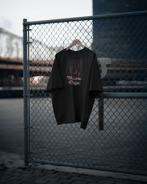 urban-streetwear-boxy-tshirt-mockup-hanging-on-fence-with-industrial-backdrop-011491.jpg