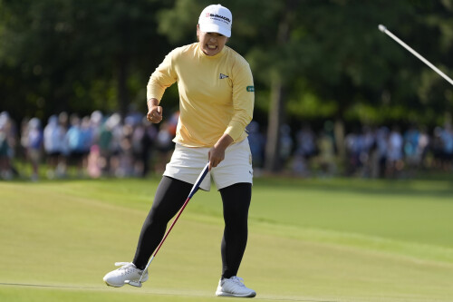 asian806-mao-saigo-japanese-golfer-Mao-Saigo-of-Japan-celebrates-her-birdie-putt-on-the-18th-green.jpg